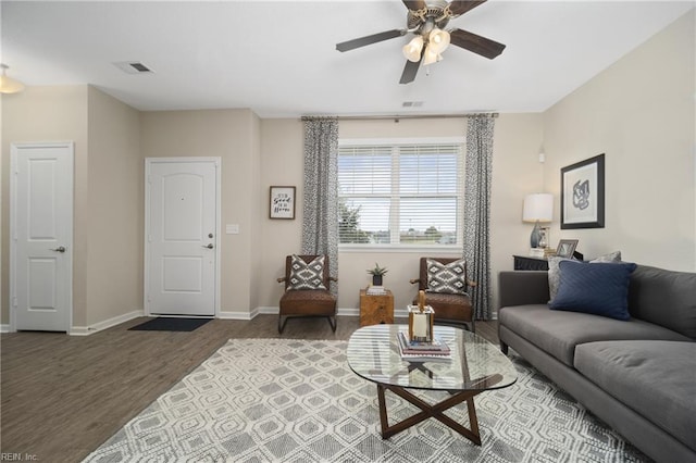 living room with hardwood / wood-style flooring and ceiling fan