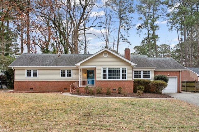 single story home with a front yard and a garage