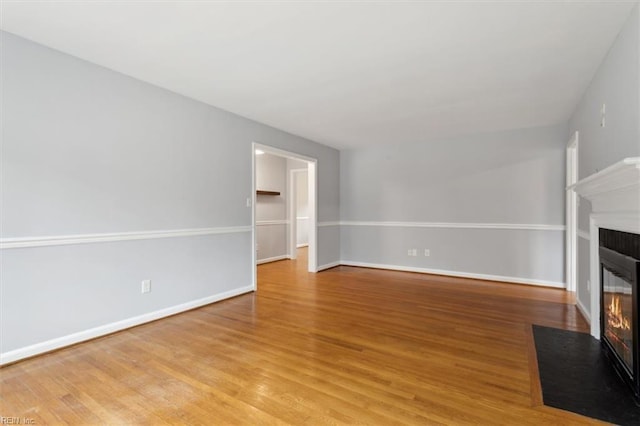 unfurnished living room with light hardwood / wood-style flooring