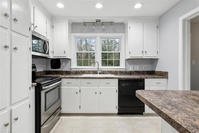 kitchen featuring sink, appliances with stainless steel finishes, and white cabinetry