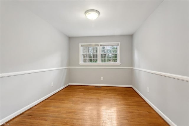 unfurnished room featuring light hardwood / wood-style floors
