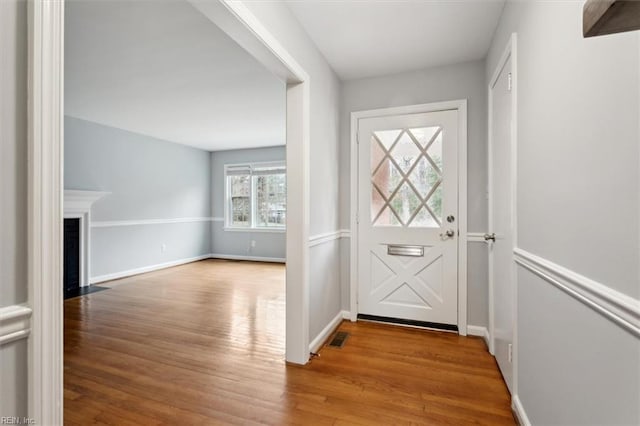 doorway with light wood-type flooring