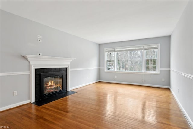 unfurnished living room featuring light wood-type flooring