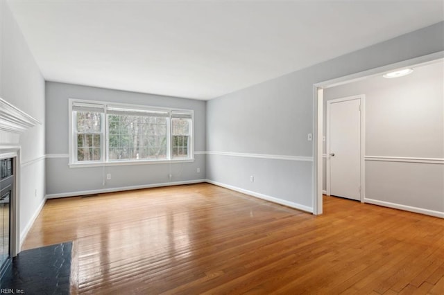 unfurnished living room featuring light wood-type flooring