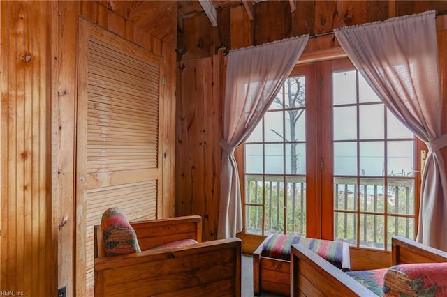 bedroom with wood walls