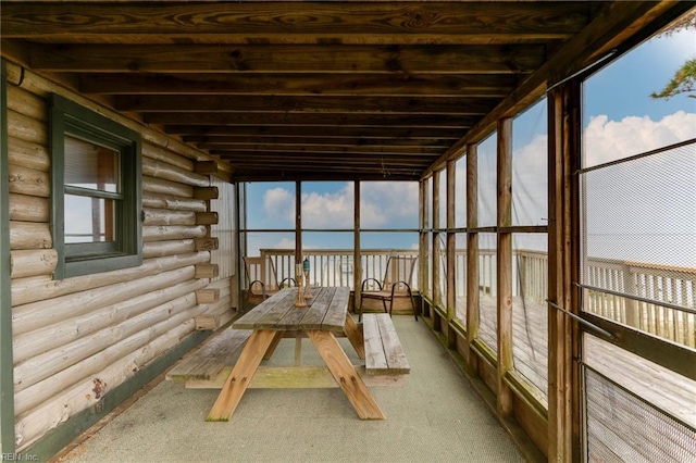 unfurnished sunroom with plenty of natural light