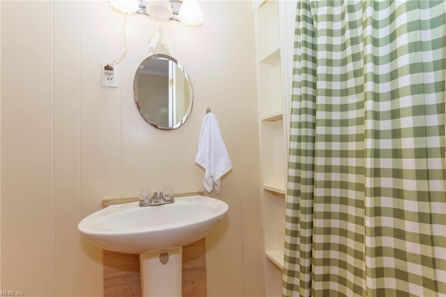 bathroom featuring a shower with curtain