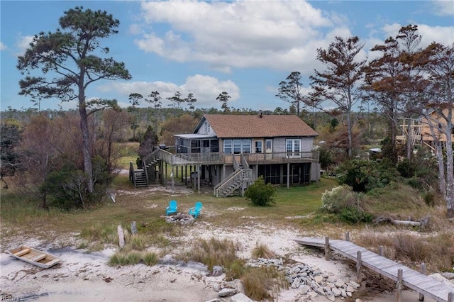 rear view of property with a wooden deck