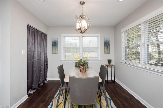 dining space featuring plenty of natural light, dark wood finished floors, and baseboards