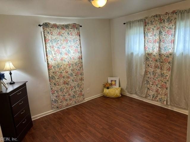 empty room featuring dark hardwood / wood-style floors