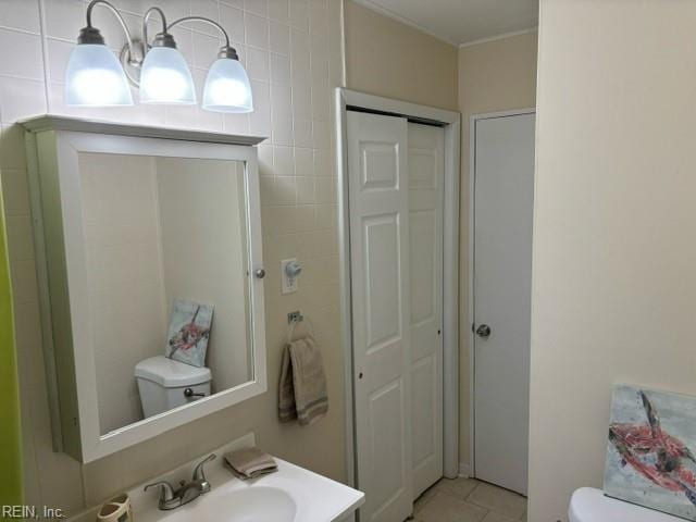 bathroom with tile patterned floors, toilet, and vanity