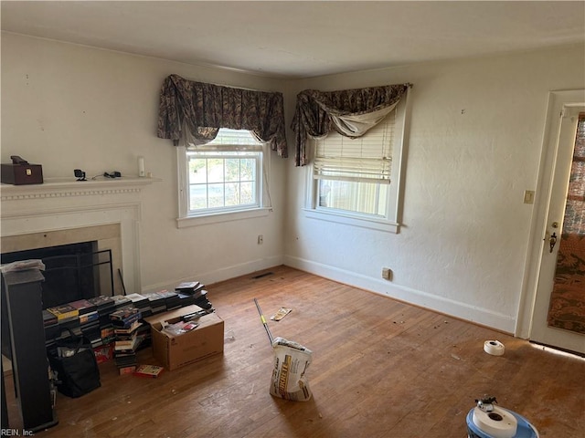 unfurnished living room featuring hardwood / wood-style flooring