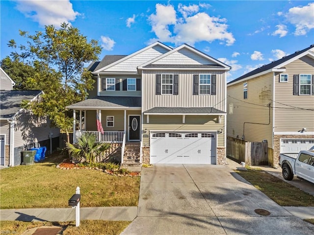 view of front of property featuring covered porch, a garage, and a front lawn