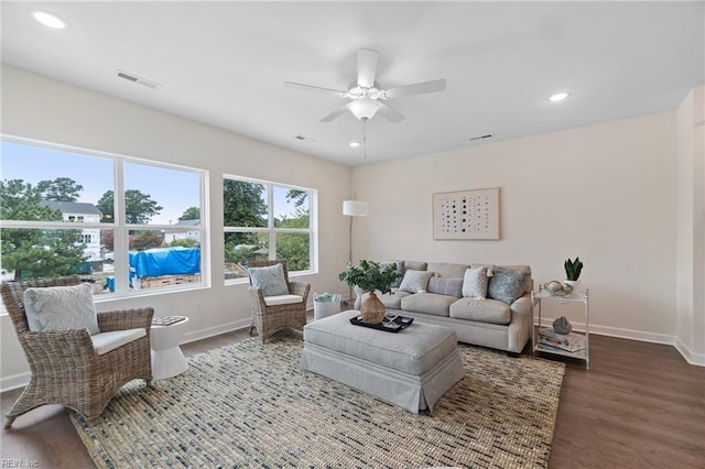 living room featuring hardwood / wood-style flooring and ceiling fan