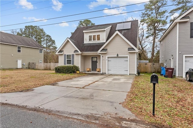 view of front facade with a front yard and a garage