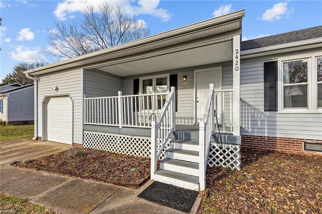 single story home featuring a garage, crawl space, covered porch, and concrete driveway