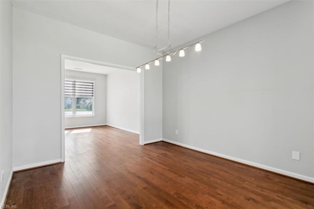 unfurnished room with hardwood / wood-style floors