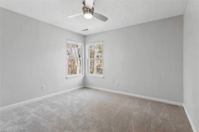 carpeted empty room with ceiling fan