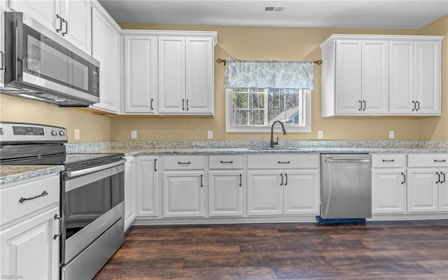 kitchen featuring sink, white cabinets, and stainless steel appliances