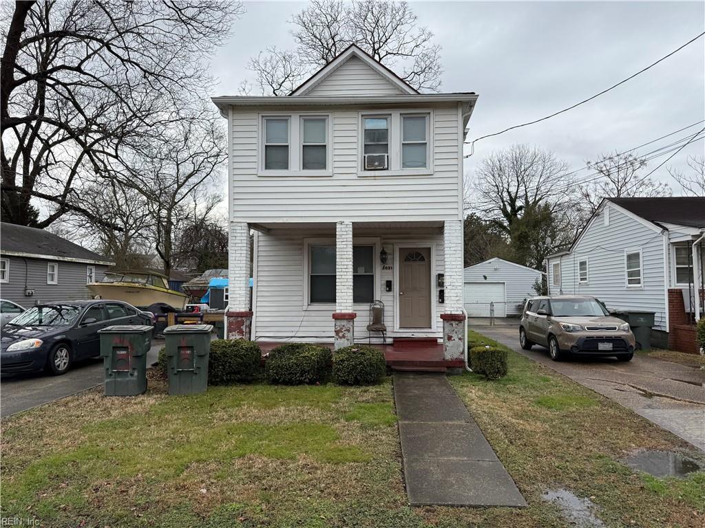 view of front property featuring a front lawn and a porch