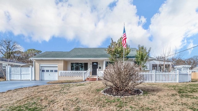 ranch-style home with a front yard and a garage