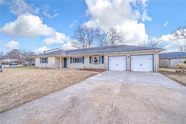 ranch-style home featuring a garage, concrete driveway, and brick siding