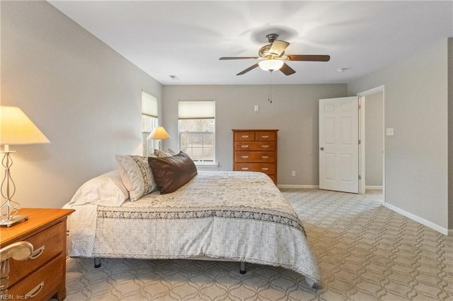 bedroom with visible vents, carpet, a ceiling fan, and baseboards