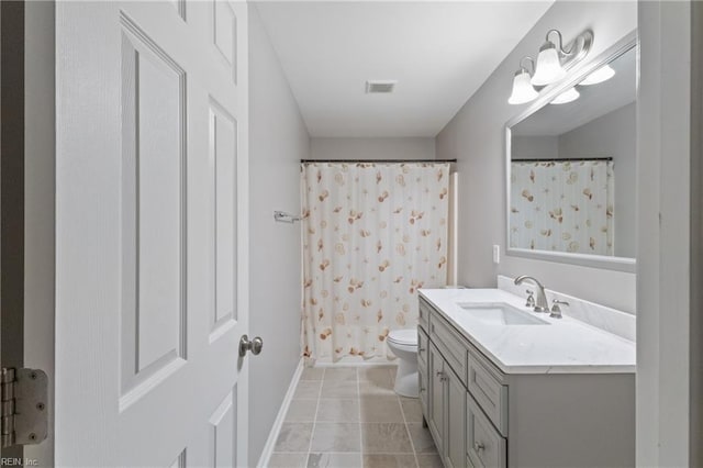 bathroom with tile patterned flooring, toilet, visible vents, vanity, and baseboards