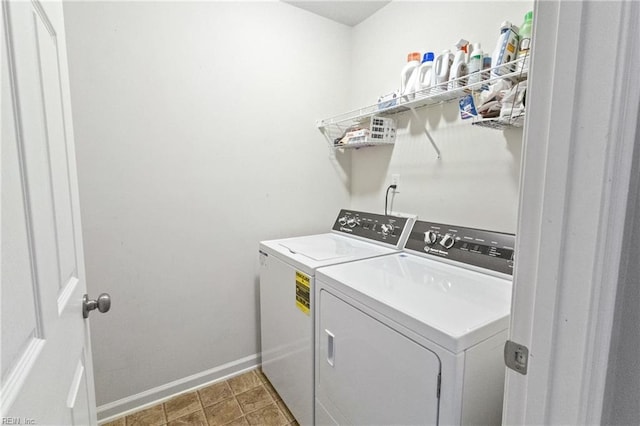 laundry area featuring laundry area, washer and clothes dryer, and baseboards