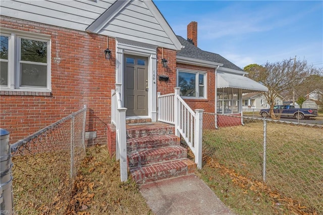 entrance to property with a yard