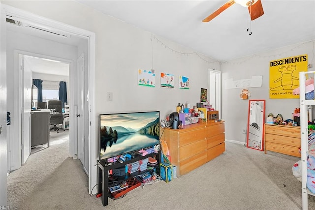 bedroom with ceiling fan and light carpet