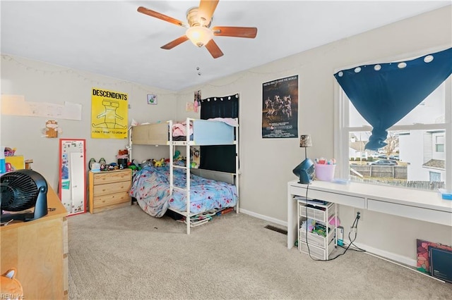 carpeted bedroom featuring vaulted ceiling and ceiling fan