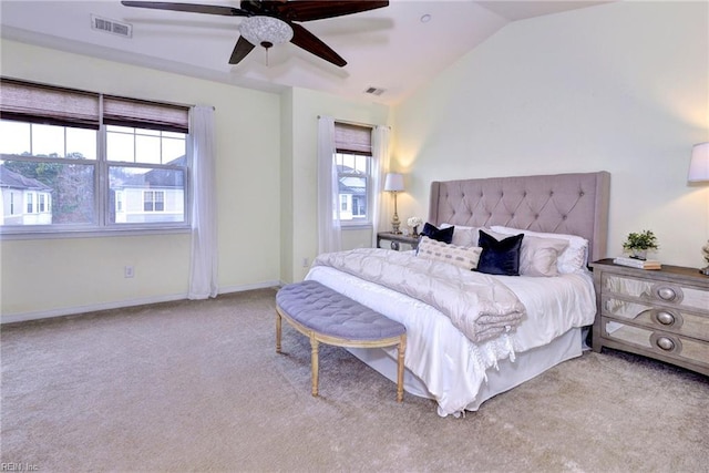 bedroom with baseboards, visible vents, vaulted ceiling, and light colored carpet