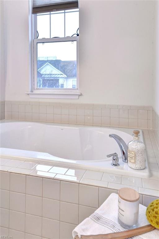 full bath with a relaxing tiled tub