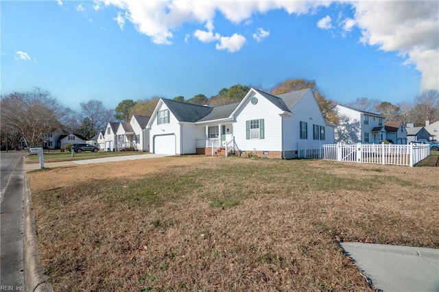 view of front of property with a front lawn and a garage