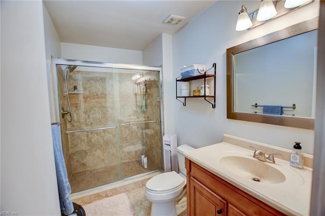 full bathroom with toilet, a shower stall, visible vents, and vanity