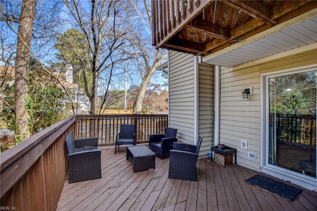 wooden deck featuring an outdoor hangout area