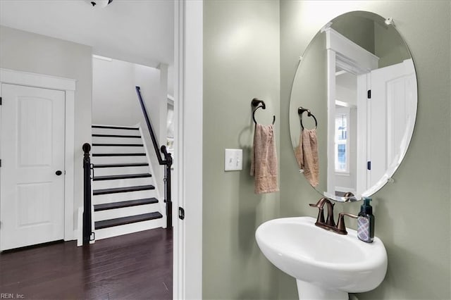 bathroom with a sink and wood finished floors