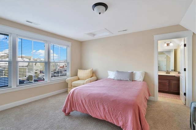 bedroom featuring light colored carpet, a sink, visible vents, baseboards, and attic access