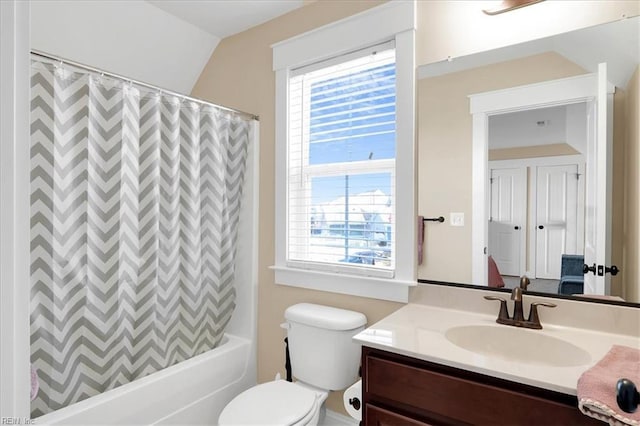 bathroom with a wealth of natural light, vanity, toilet, and shower / bath combo