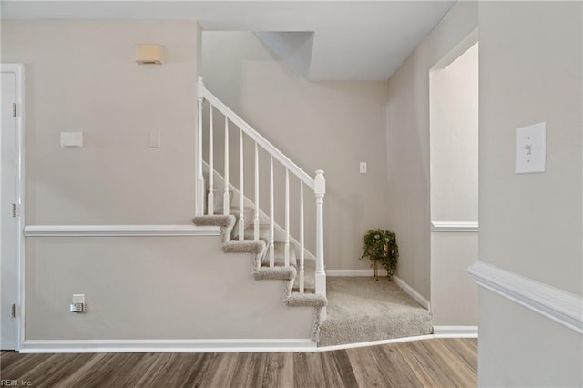 stairs with wood-type flooring