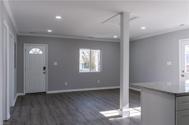 foyer entrance with dark wood-style floors, baseboards, crown molding, and recessed lighting