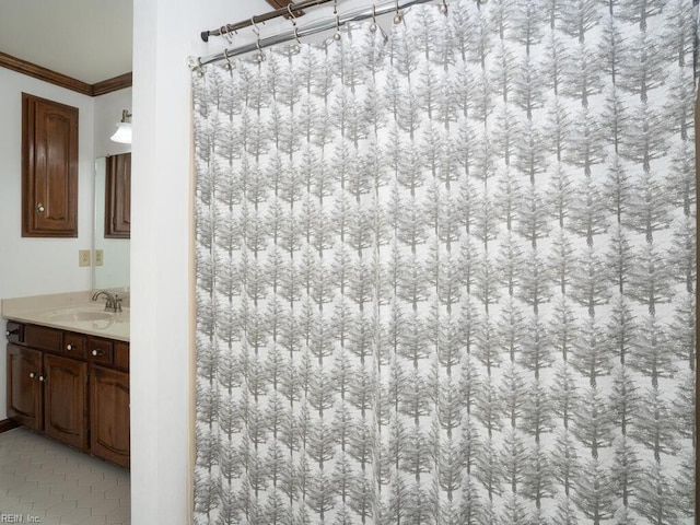 full bathroom featuring tile patterned flooring, crown molding, vanity, and curtained shower