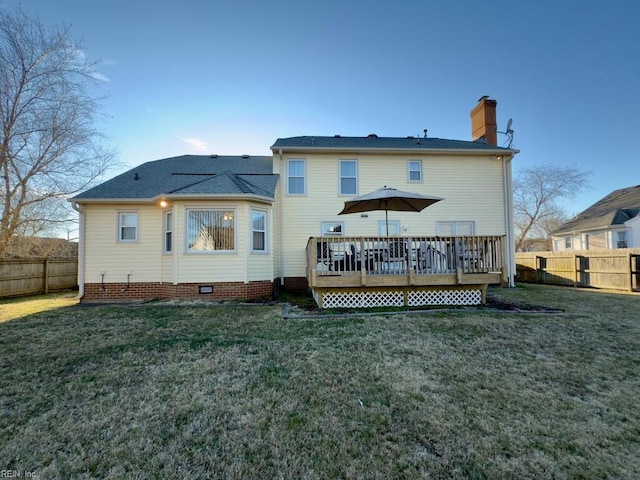 back of house with a lawn, a fenced backyard, a chimney, crawl space, and a wooden deck