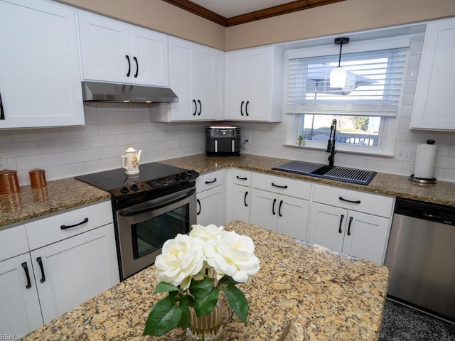 kitchen with appliances with stainless steel finishes, white cabinets, a sink, and under cabinet range hood