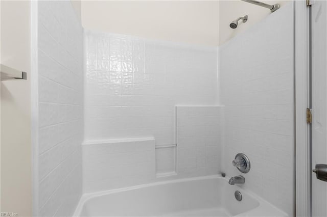 bathroom with bathing tub / shower combination