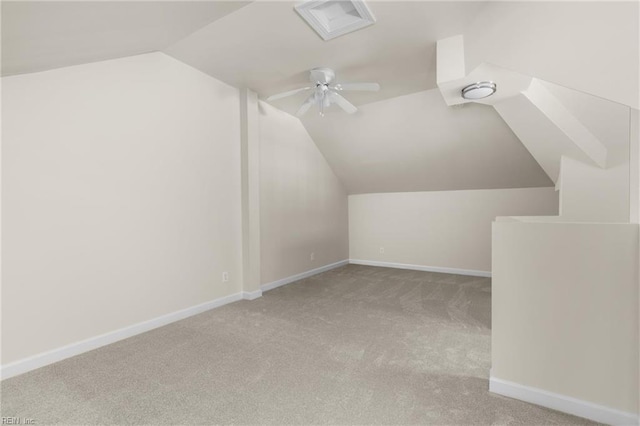 bonus room with light carpet, vaulted ceiling, and ceiling fan