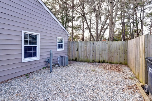 view of yard with a fenced backyard and cooling unit