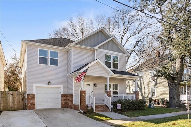 craftsman-style house with driveway, an attached garage, fence, a porch, and brick siding