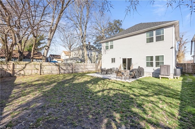 rear view of house featuring a fenced backyard, central AC unit, a patio, and a yard